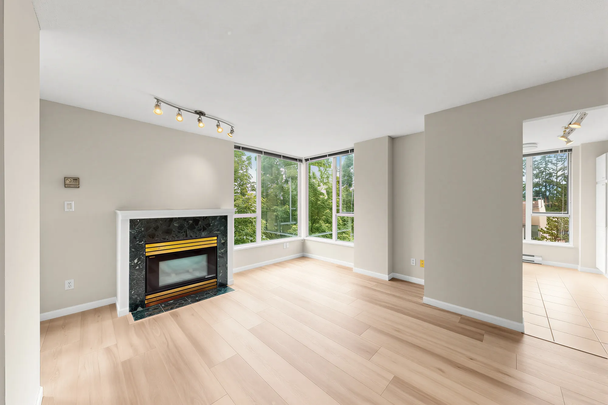 The living room from the dining end, fireplace on the left