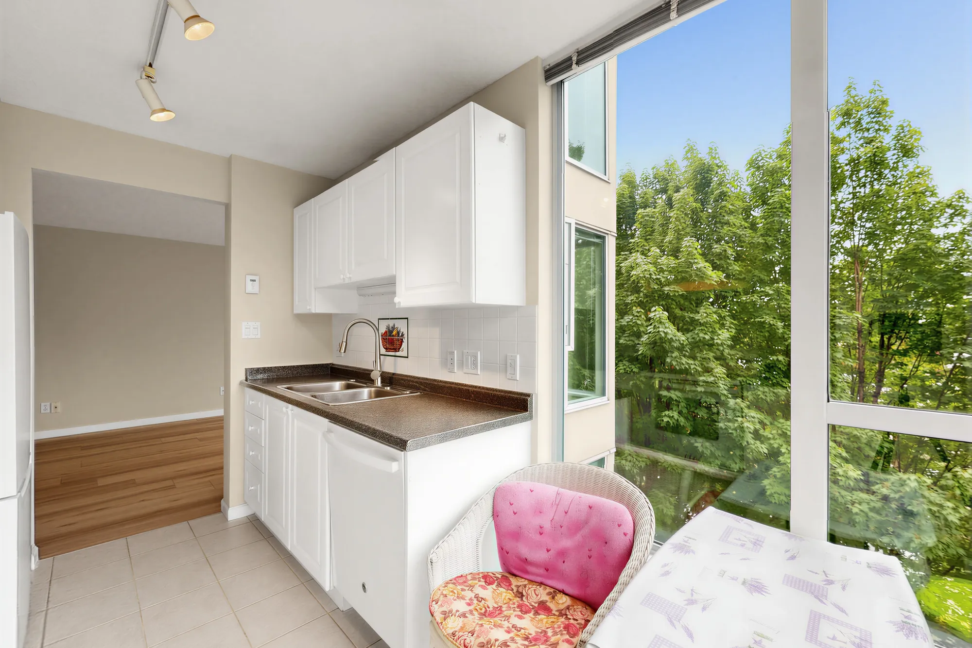The nook from the kitchen, the counter and window beyond